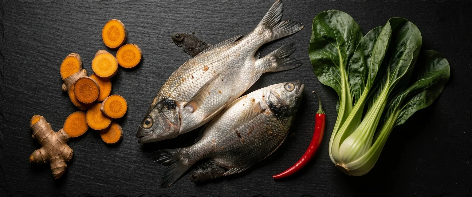 Fresh local Indonesian ingredients arranged on a dark surface